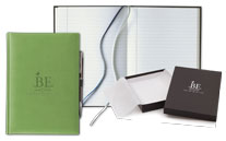 green faux leather journal with pen and gift box